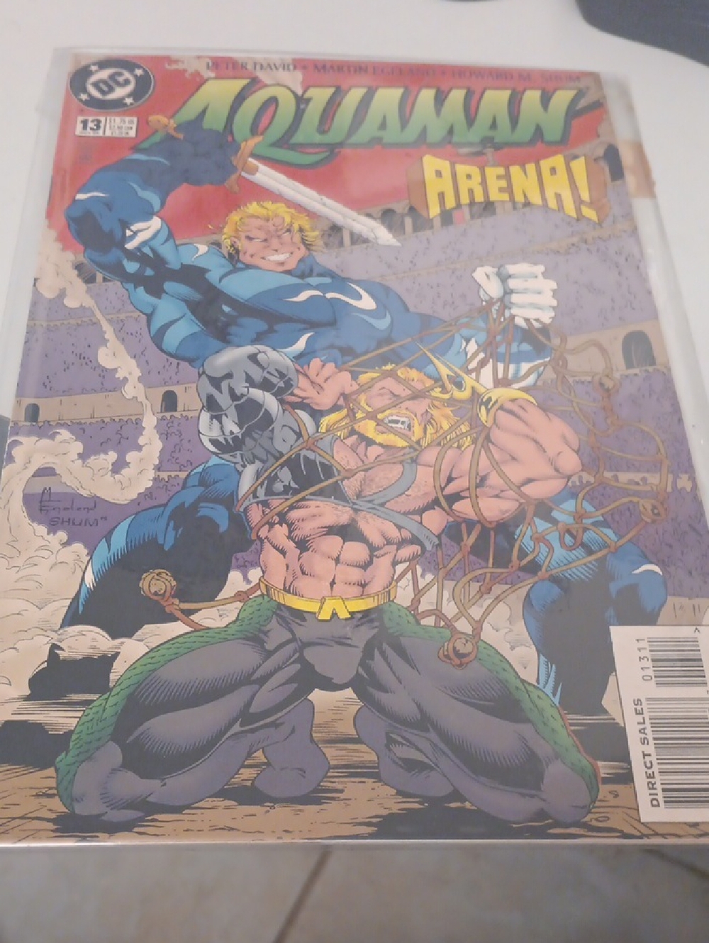 DC Aquaman Comic Cover with Blue, Green and Yellow Accents In A Sleeve